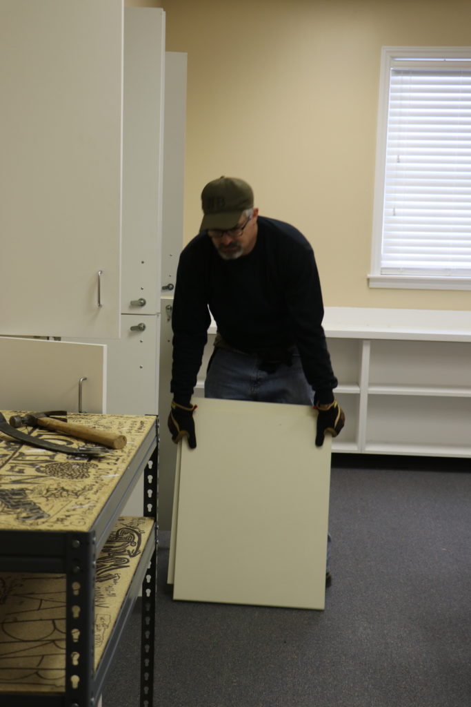 Darren Johnson helps demo casework