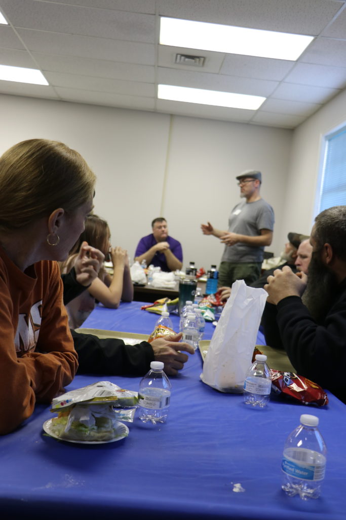 Ginger Wooten, Mike Wagner, And the rest of the group listen as Asst Troop Leader Tyler Higdon addresses the group.